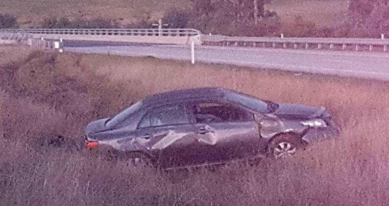 LOST CONTROL: The car which landed in the median strip of the Hume Freeway.