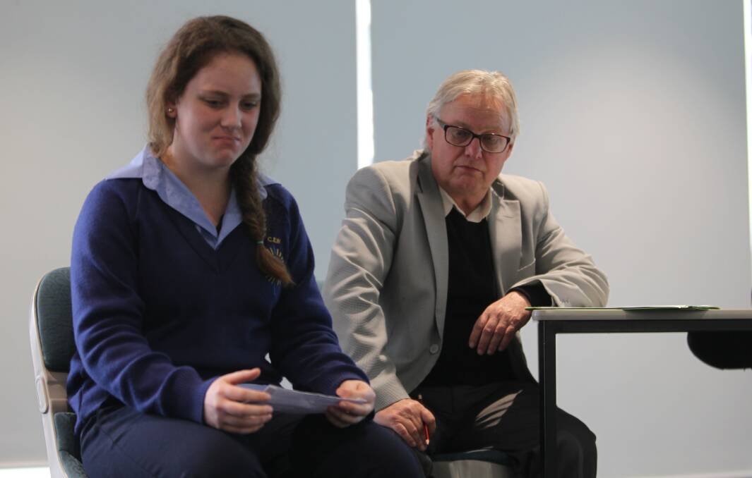 PORTRAYING PAIN: Year 11 student Chelsea Probyn and veteran actor John Walker performed vignettes for staff in the Agriculture Victoria Wodonga office on Wednesday. Picture: SHANA MORGAN.