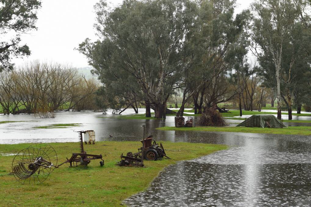 MORE RAIN COMING: Water levels of the Kiewa River rose onto a Kiewa property earlier this month. Picture: MARK JESSER