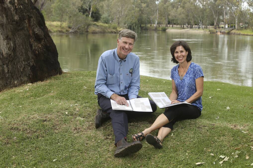 NINE YEARS OF WORK: Lauriston Muirhead and Lizette Salmon from Wodonga Albury Toward Climate Health with almost a decade of Border Mail letters. Picture: ELENOR TEDENBORG