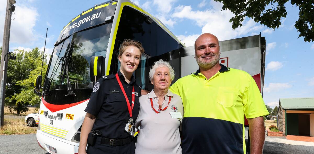 UNITED: Kayla Dwyer from the CFA Mobile Engagement Unit, Heather Stephens from Red Cross and Cr Emmerick Teissl at Wooragee Centenary Hall. Picture: JAMES WILTSHIRE
