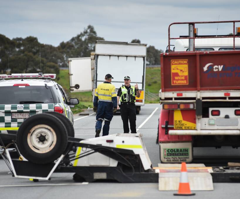 SAFETY CHECK: VicRoads and police officers worked together to inspect trucks and cars during Operation Combine at Glenrowan. They will be back between Benalla and Springhurst on Tuesday. Picture: MARK JESSER