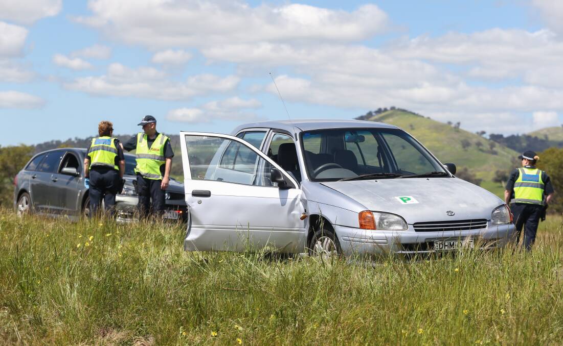 CAUGHT: Police with the stolen hatchback vehicle. Picture: MARK JESSER