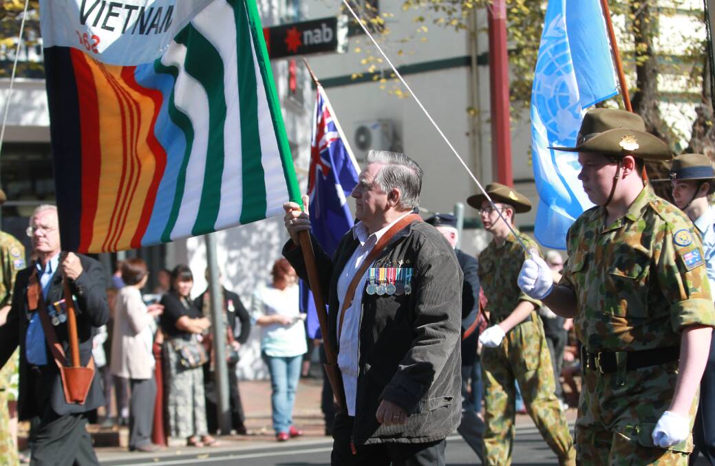 PROUD MOMENT: Vietnam veteran John Gerbes had made a tradition of carrying the banner in the Wangaratta Anzac Day march each year.