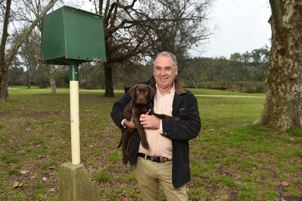 NEW COUNCIL GOALS: Murray King with his dog Chester at the old site of the caravan park at Noreuil Park.