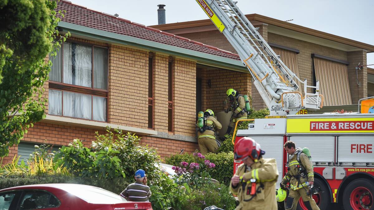 EMERGENCY RESPONSE: Firefighters put out a blaze in the roof of a Vickers Road home, which started about 4.15pm Wednesday. Pictures: MARK JESSER