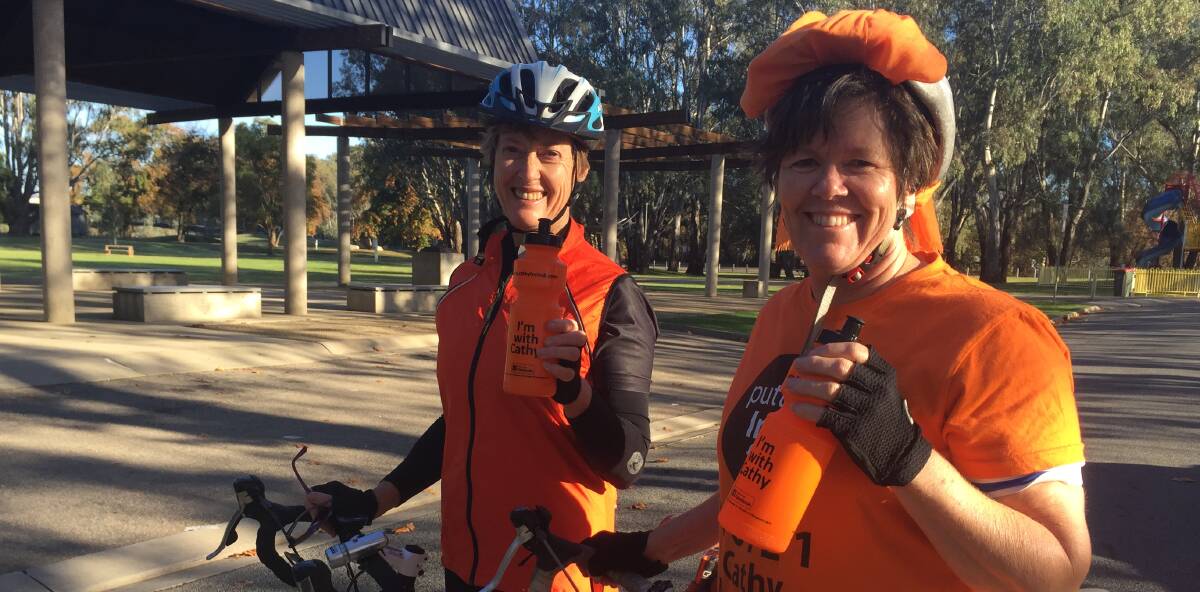VOLUNTEER LOVE: Loretta Atkin and Clare Grogan were all smiles before a ride from Wangaratta to Myrtleford. Picture: SHANA MORGAN