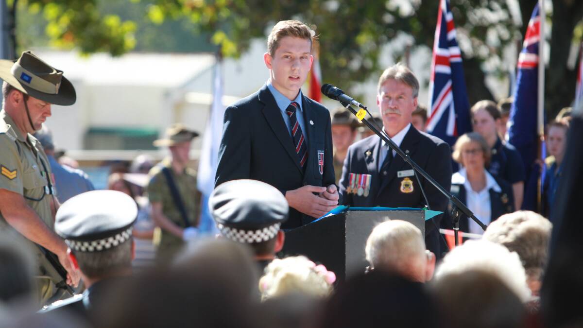 A DAY TO REMEMBER: Hundreds lined the streets to watch Wangaratta's Anzac Day march, then gathered for a service at the cenotaph. Pictures: SHANA MORGAN