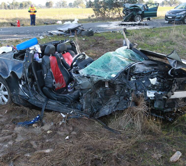 CARNAGE: The Nissan sports car after SES volunteers cut off the roof. Pictures: BLAIR THOMSON