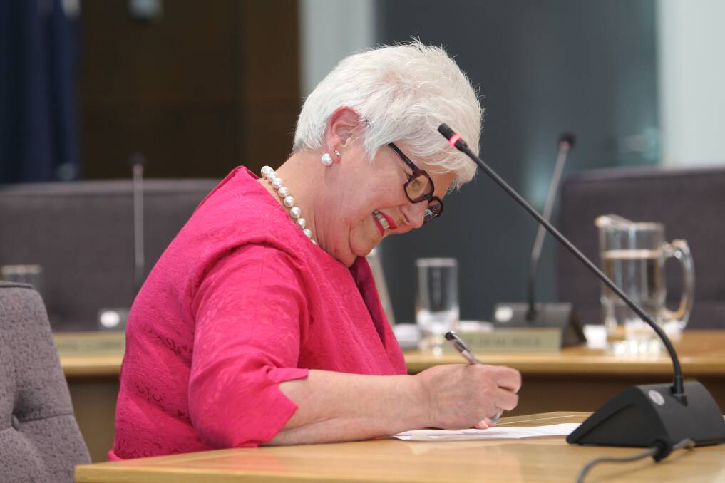 HAPPY OCCASION: Cr Ruth Amery signs her declaration to become a councillor. Picture: SHANA MORGAN