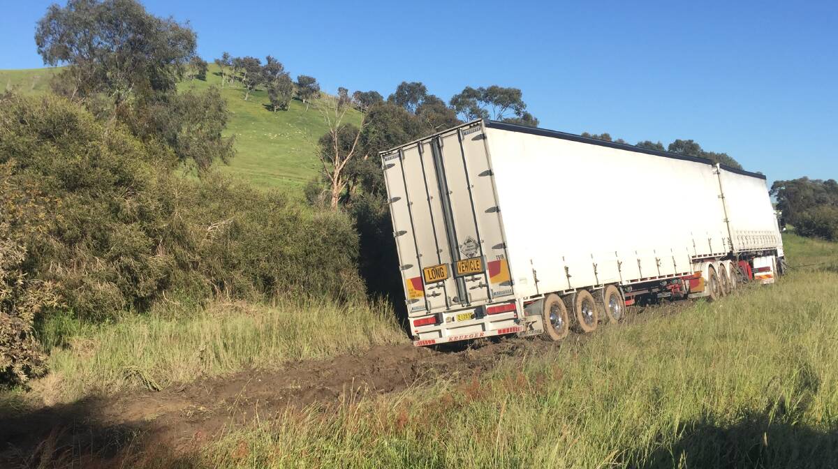 BOGGED: Northbound traffic on the Hume Freeway was slowed to one lane for a few hours while this B-double truck was cleared on Friday morning.