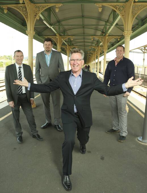 HERE WE GO: Cr Kevin Mack at Albury Railway Station with the team on his ticket: John Stutchbery, Ross Jackson and Josh Cale. Picture: ELENOR TEDENBORG