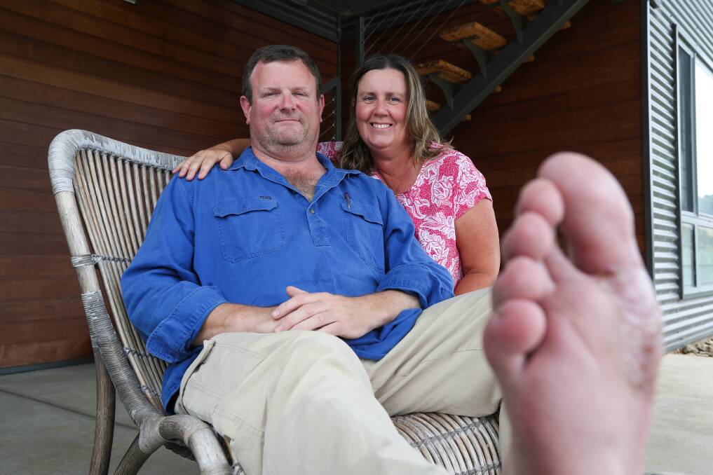 SPREADING THE WORD: Tim Roberts slowly recovers from surgery. He and wife Phillippa know not all melanomas come from too much sun. Picture: MARK JESSER (Warning: Graphic images)