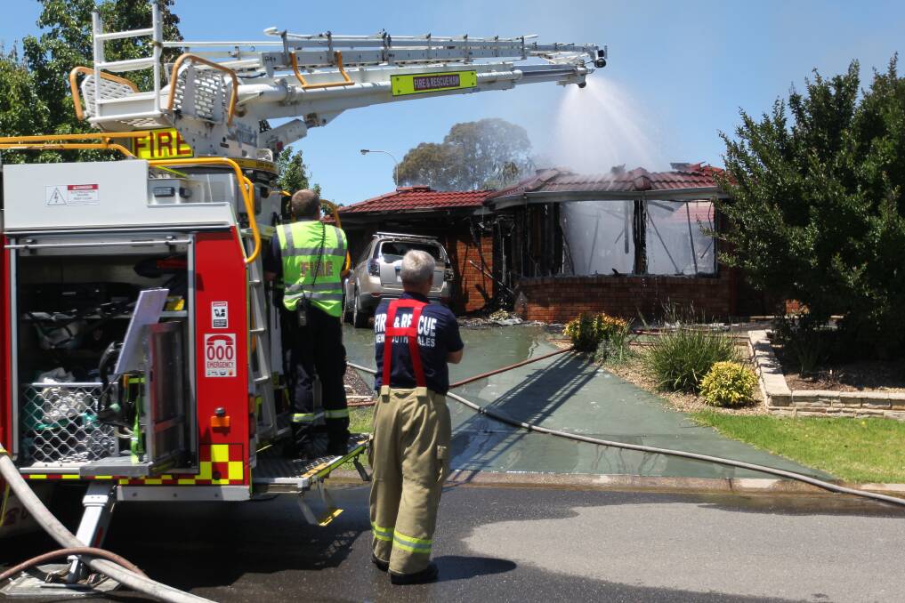 NO SAVING HOME: Albury firefighters worked for hours to extinguish the Thurgoona house fire on Wednesday. Pictures: SHANA MORGAN