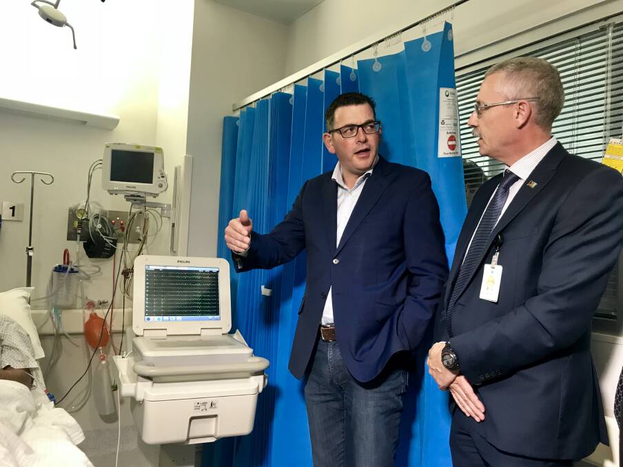 CRITICAL CARE: Premier Daniel Andrews talks to Wangaratta hospital medical services director John Elcock during Friday's visit. Picture: SHANA MORGAN