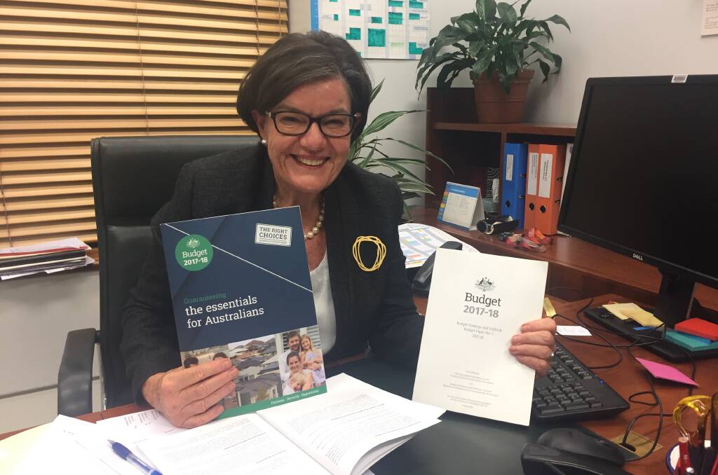WELCOME COMMITMENT: Indi MP Cathy McGowan at her Canberra office on Tuesday evening with a budget she said listened to calls for more roads and infrastructure funding in regional areas. Picture: SHANA MORGAN