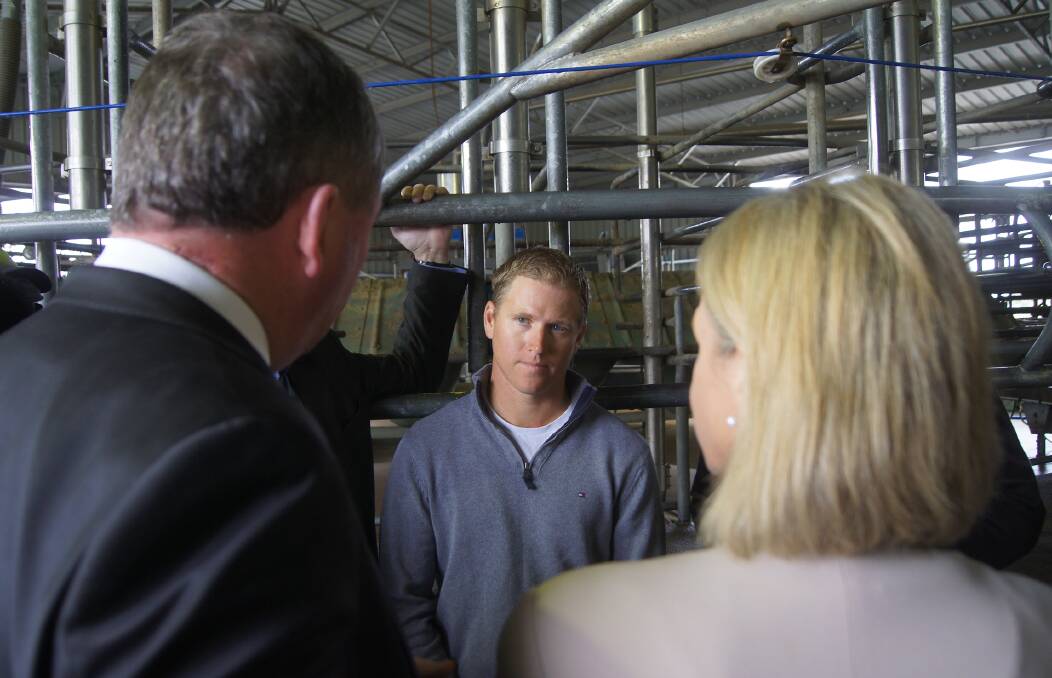 SUPPORT TALK: Dairy farmer Scott Fitzgerald in talks with Nationals leader Barnaby Joyce and Regional Health and Development Minister Fiona Nash in the Goulburn Valley this week.