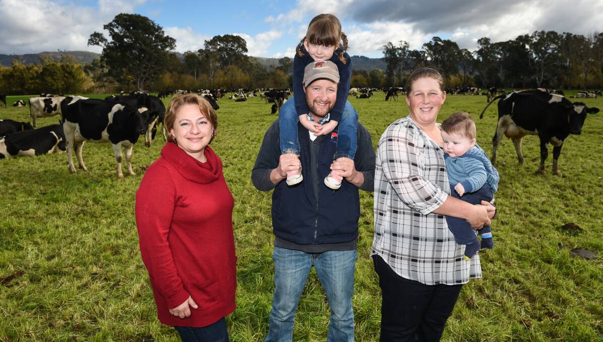 FARMING LIFE: Sophie Mirabella talks with Greta's Justin and Brooke Evans, and their children Fairlie, 3, and Henry, 6 months. Picture: MARK JESSER