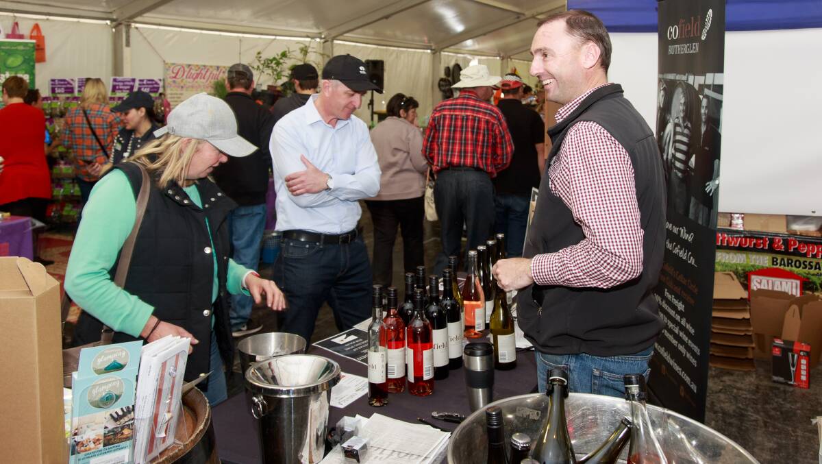 FOR EVERY TASTE: Winemaker Damien Cofield, Cofield Wines, Wahgunyah, explains wine styles at the Farmers Market food hall at Henty. Picture: SIMON BAYLISS