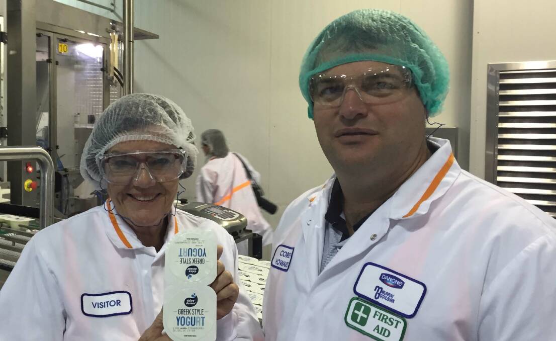 Cathy with Danone MG production manager Corey Howard during the visit to the Kiewa dairy to see the successful partnership tipped to grow.