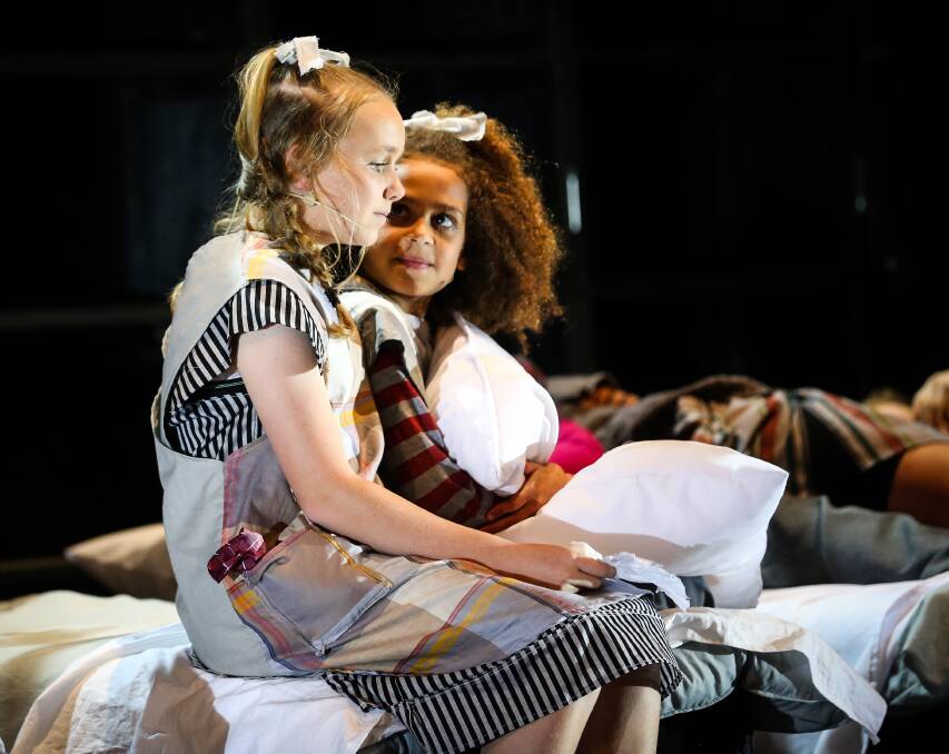 STAR ATTRACTION: Georgia Moorman, who plays the lead role in Annie, speaks with fellow orphan Jacinta Churcher during the final dress rehearsal this week.  