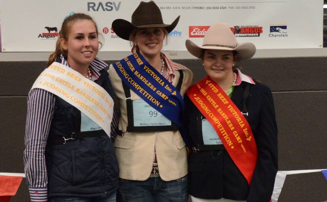 SAFE HANDS: Amelia Ghiggioli, left, is pictured with Jessica Parker and Tayla Miller at the handler's camp. The three were named overall best in the handling competition held in Bendigo. Picture: OUTLOOK PRESS   