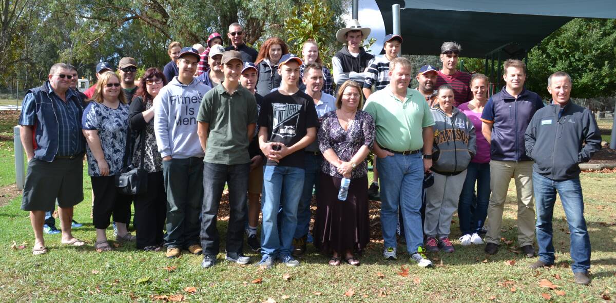 AMONG FRIENDS: Students and their families pose with their farm hosts at Kiewa on Sunday ahead of a week living and working on North East dairy farms.