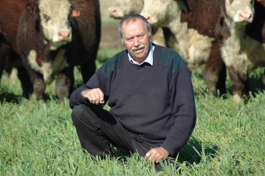 Speaker Phil Glover inspects pasture at his property, Weetaliba.