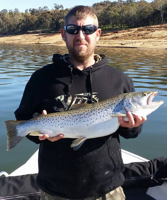 Jason Boyd shows off the 75cm 10lb brown trout he caught with a tassie in Lake Hume. The big fish are still being caught in the lake, be it trout, yellas or reddies.
