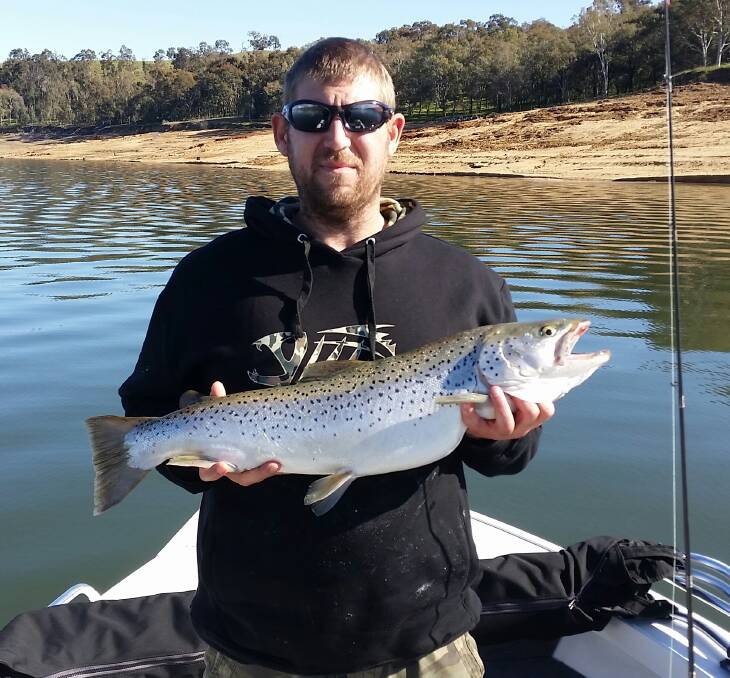 Jason Boyd shows off the 75cm 10lb trout he caught with a tassie in Lake Hume.
