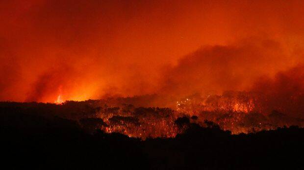 Flames sweep towards the heritage-listed NSW Central Coast town of Catherine Hill Bay on October 12, 2013. Photo: Jonathan Carroll
