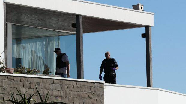 Police search John Ibrahim's clifftop home in Dover Heights on Tuesday as part of raids across Sydney. Photo: Janie Barrett
