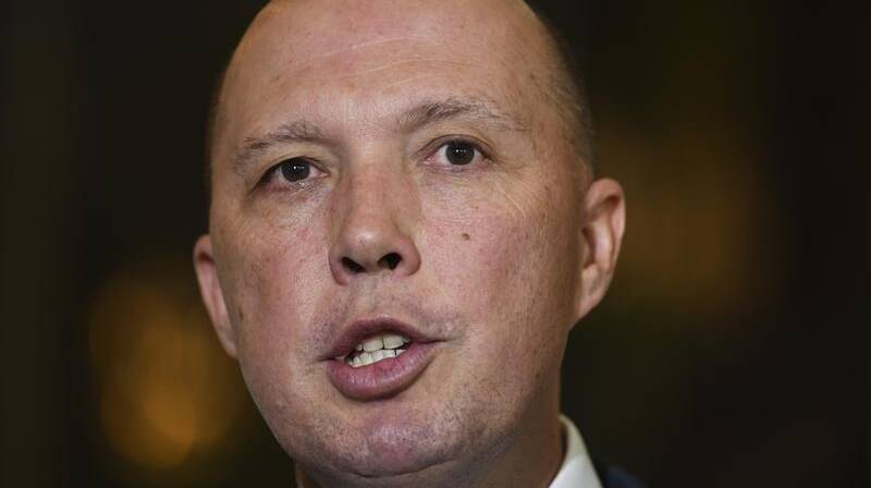 Peter Dutton has defended the directive that refugees on Naura must sever family ties. Photo: AAP