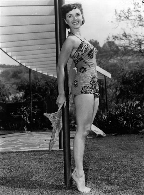 Debbie Reynolds modelling a swimsuit in the garden. Original Publication: People. Photo: Keystone/Getty Images