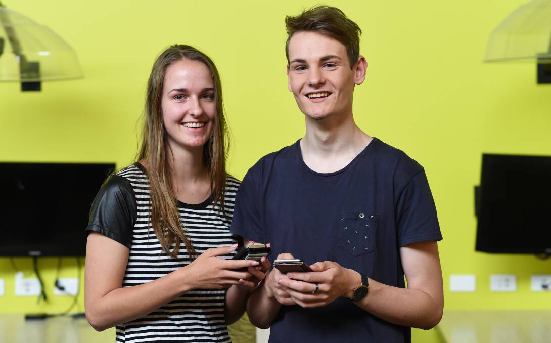 IT'S OVER: Twins Rylee and Tyler Beck got their ATAR results early on Wednesday night, and were chuffed with their scores. Picture: MARK JESSER 