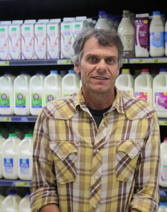 GESTURE: Anthony Hewett says he wants to choose a milk brand to help dairy farmers but needs more information to make an informed choice. Picture: DERRICK KRUSCHE