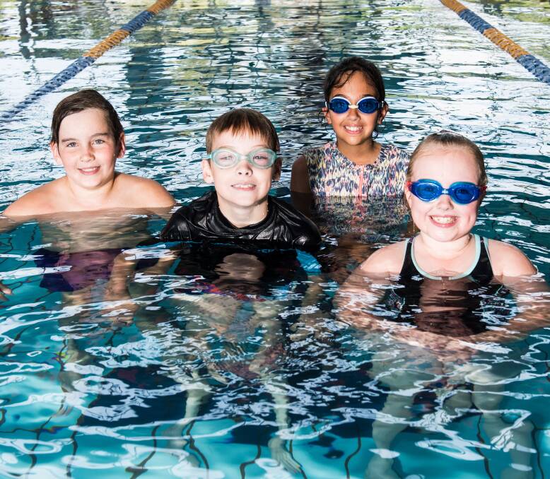 WADE: Jeremy Scone, Tyler Davies, Maddison Wheatley and Destiny Schorbura, all 9, at Wodonga Sports and Leisure Centre following the Victorian Government's announcement of mandatory swimming lessons. Picture: SIMON BAYLISS