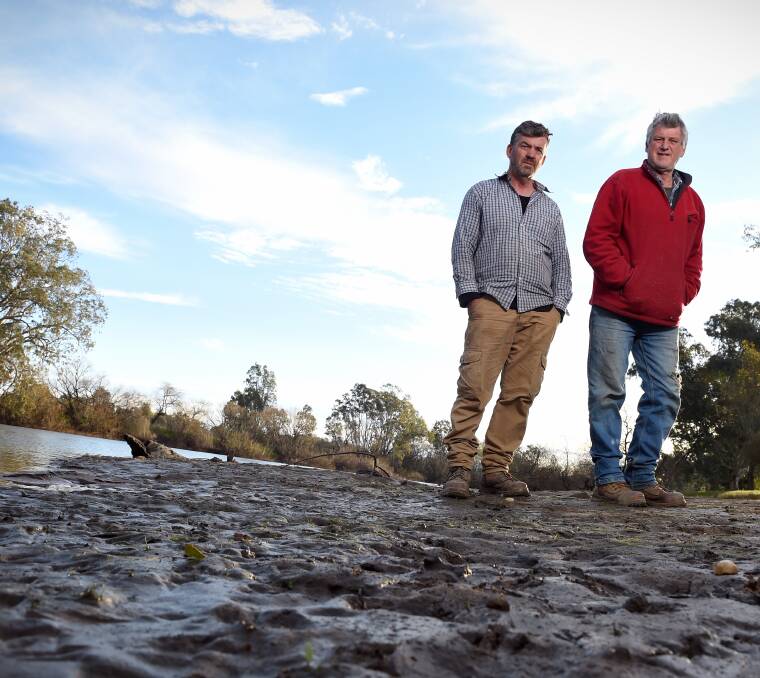 CROPPERS: Anthony Keck and Byron Gray monitor the Murray's water levels. Pictures: MARK JESSER