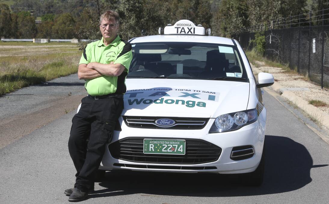 UNEASE: Wodonga cabbie Neil Cullen has slammed the Victorian government’s decision to buy-back taxi licences for what he says is an unfair price as it prepares to legalise ride-sharing services such as Uber. Picture: ELENOR TEDENBORG