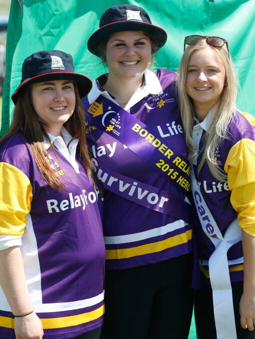 SOLIDARITY: Gemma Chapman, Breanne Shaw and Shana Wilcox during last year's relay. Breanne is a bone cancer survivor. Picture: MARK JESSER