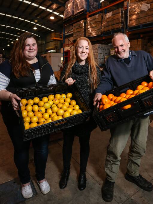 FRESH IS BEST: Wodonga Council youth leadership program members Erin McCallum and Kelsey Freeman with FoodShare's Peter Matthews. Picture: JAMES WILTSHIRE