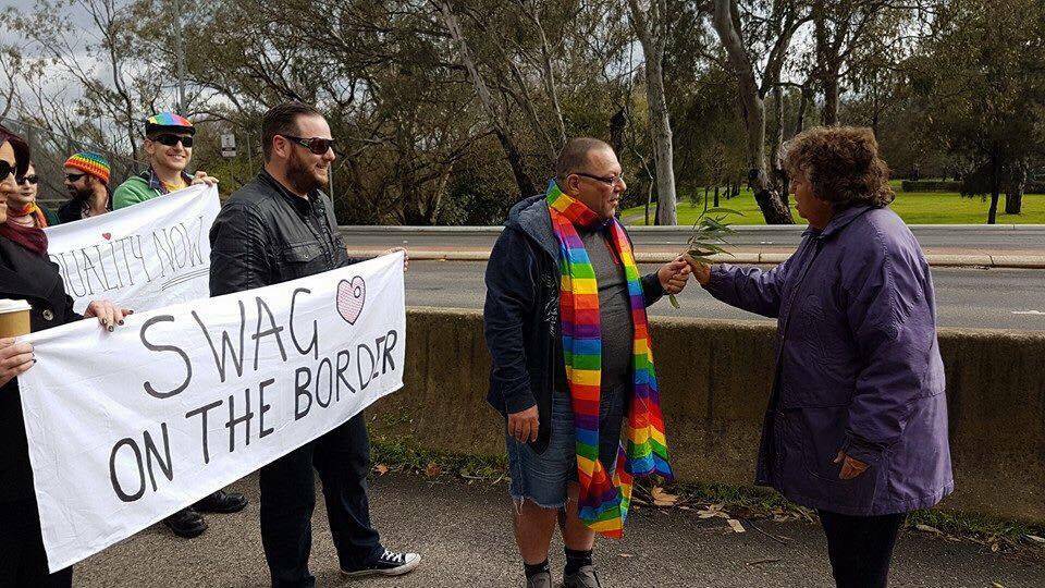 UNITY: SWAG founder Brian Kuehn and his fellow LGBTIQ community members are greeted by Wiradjuri elder Nancy Rooke as they march into Albury on Saturday morning.