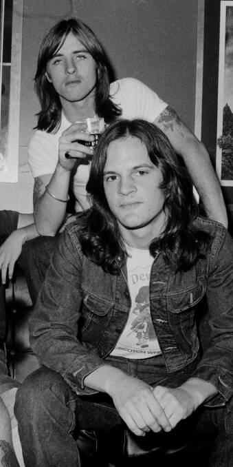 JAILBREAK: Mark Evans sits in front of AC/DC drummer Phil Rudd while on tour in London in April, 1976.