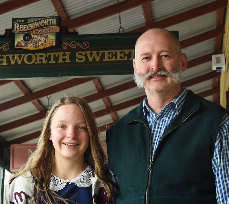 CONTEST: Anna, 12, and her father Lawrie Piko, who argues the golliwog could cause offence.