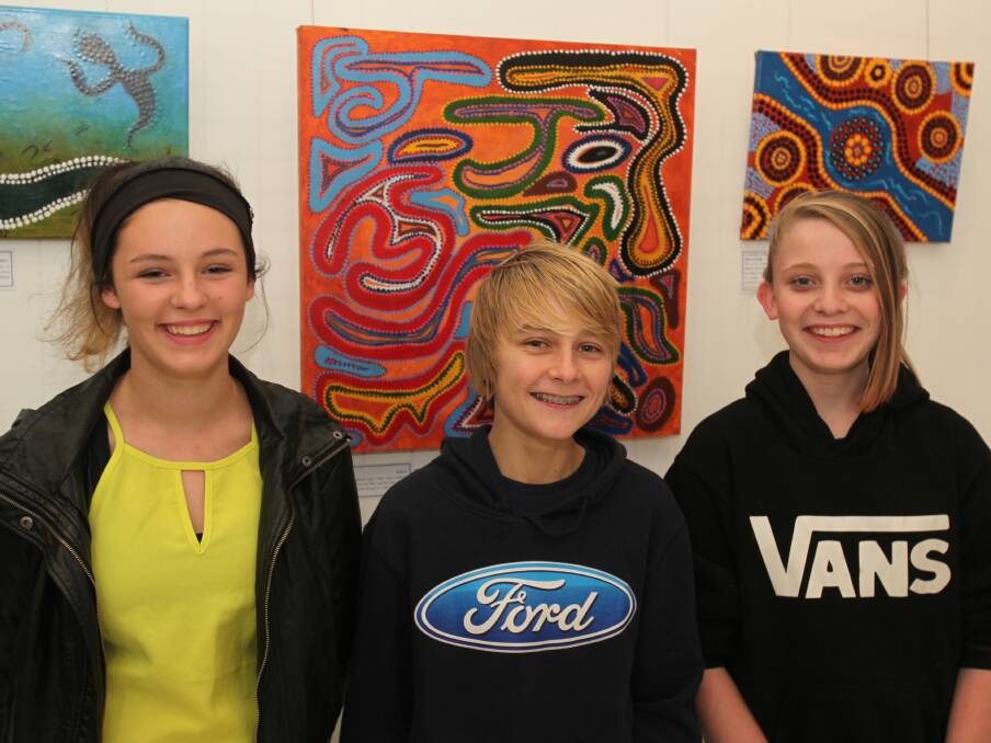 ARTISTES: Wodonga Middle Years College's Tahlia Herbert, 14, Adam Sutcliffe, 15, and Jade Herbert, 14, are thrilled for their artwork displayed.