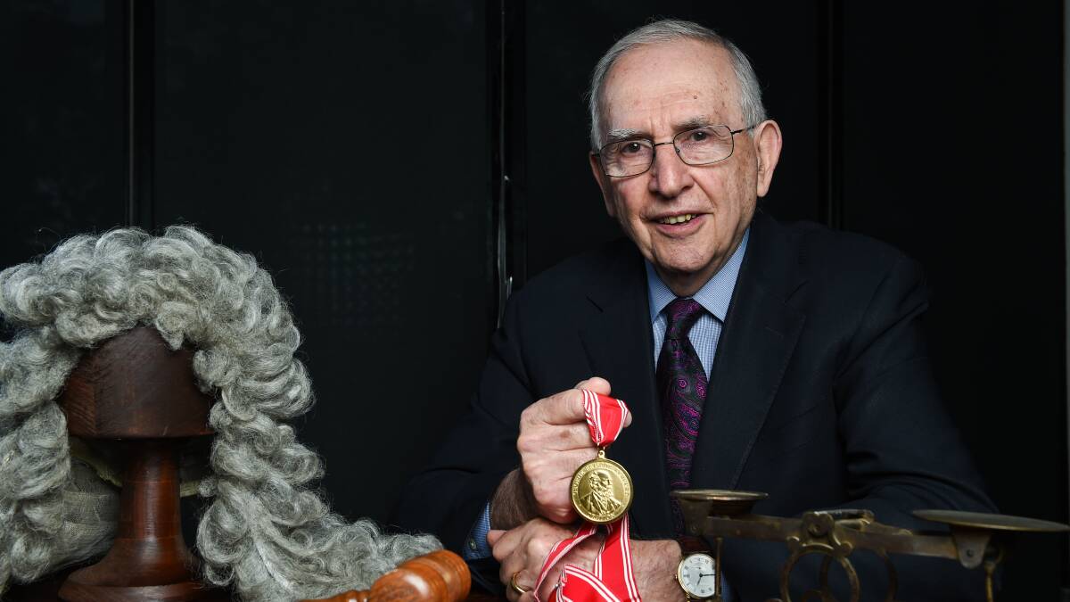 BELONGING: Hugh Mackay with the Kerferd Oration medal presented by Ian Young, a descendent of judge George Kerferd. Picture: MARK JESSER