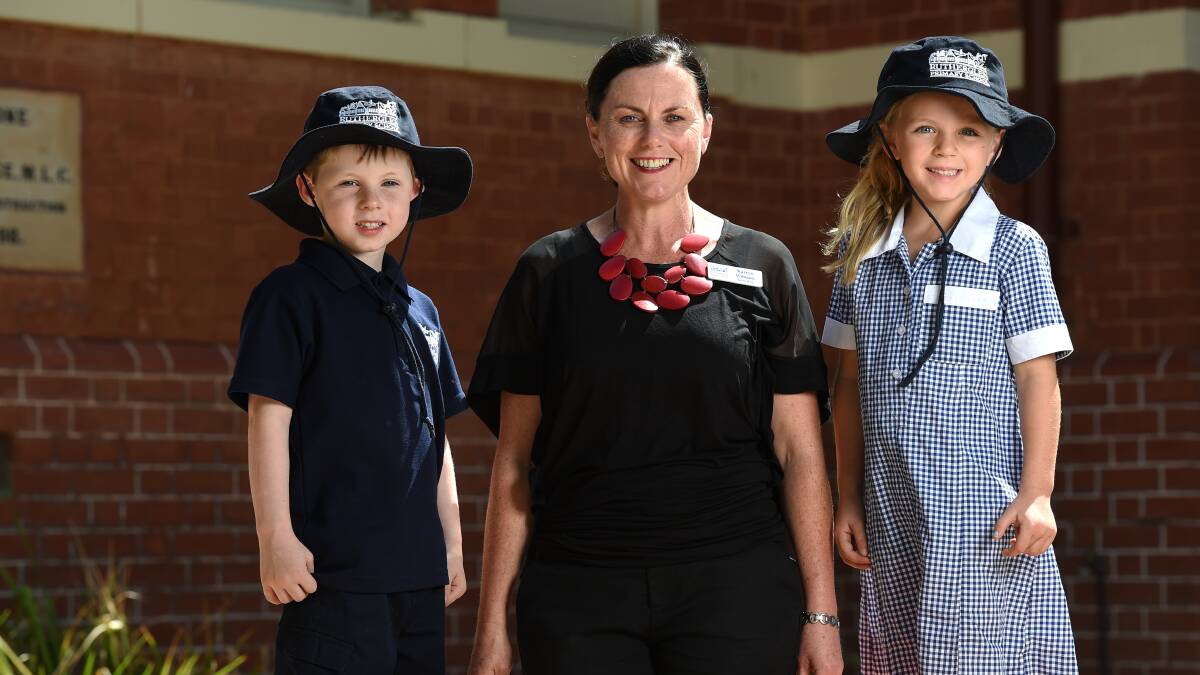 TRIO: Rutherglen Primary School students Logan Hurley and Macie Thomson, both 5, with their new principal Karryn Williams. Picture: MARK JESSER 