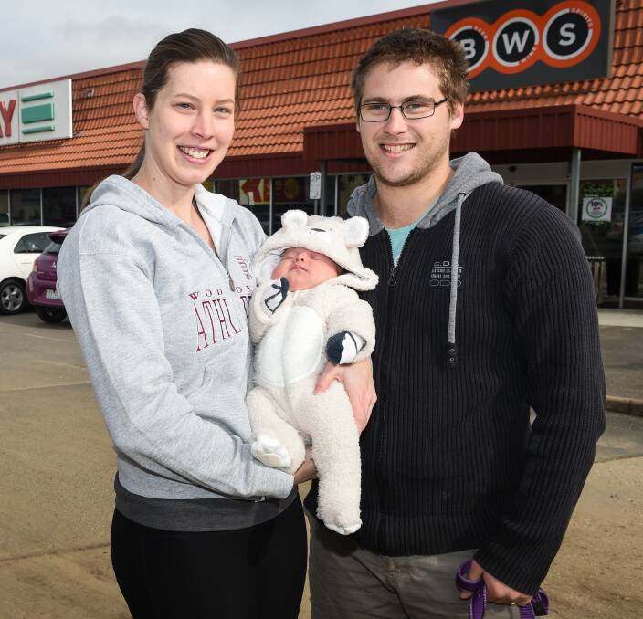 BOOST: Lisa, Lucas, 6 weeks, and Jesse McInerney are happy Wodonga's shopping district is getting a facelift, with a new $20-million Woolworths supermarket upgrade due to begin construction. Picture: MARK JESSER