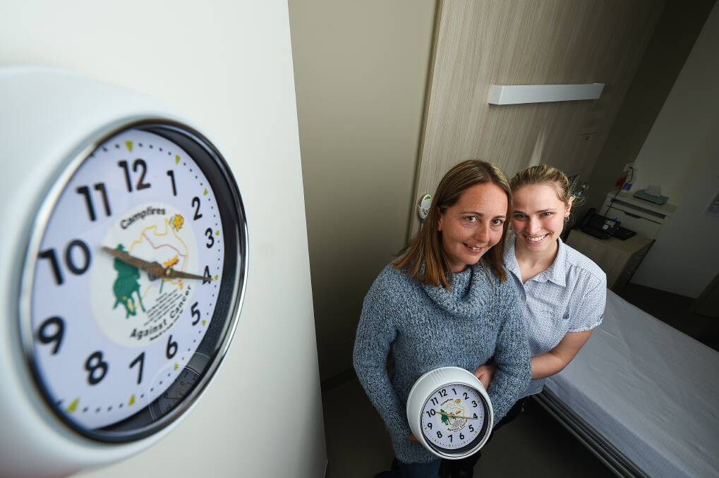 COL'S CLOCKS: Donna Mitchell and nurse Tamara Quigley with the clocks that have been donated to the cancer centre. Picture: MARK JESSER