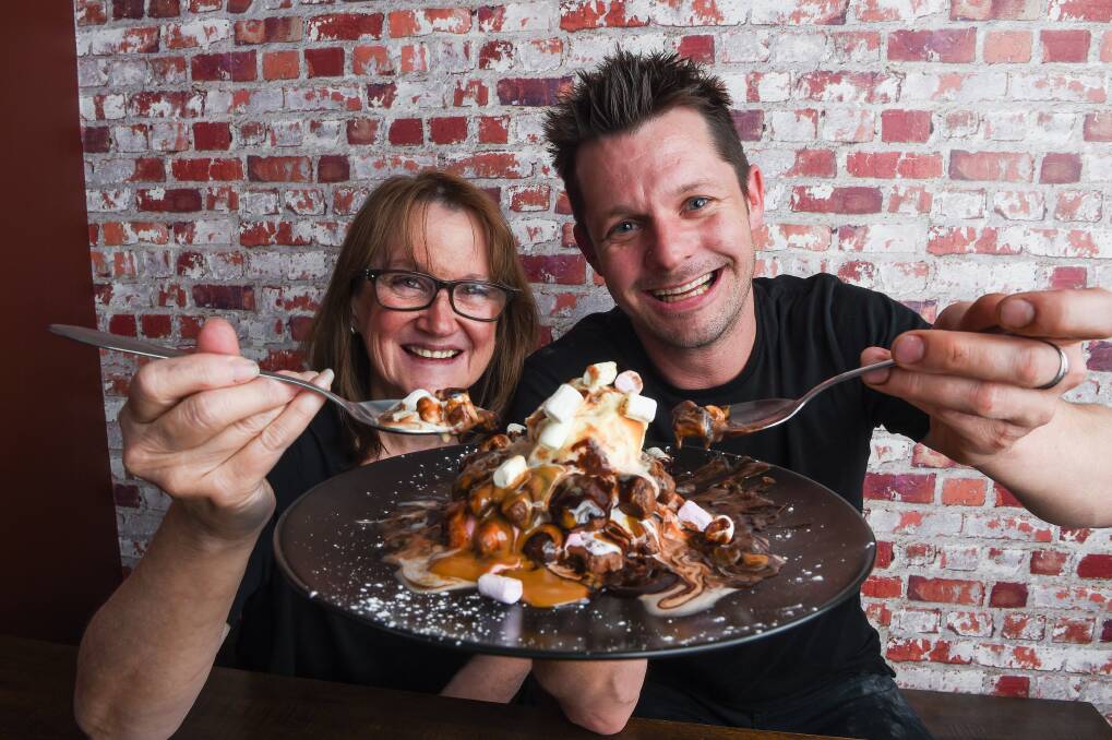 WHAT A WAFFLE: Red Brik Caffe's Heather Chowanetz and Joel Carey with their decadent gluten-free waffle of the month. Picture: MARK JESSER